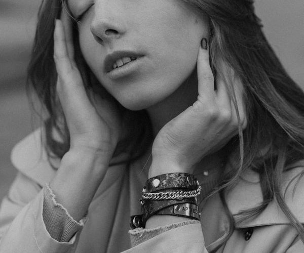 Serene face of a person meditating in a blue-lit room