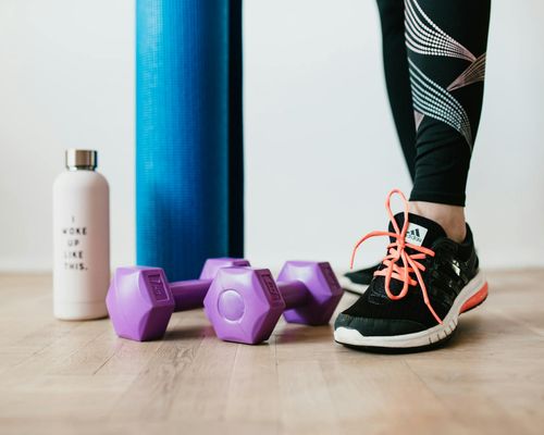 Sports mat and water bottle in a dark room